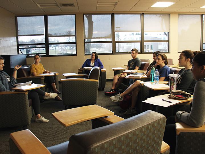 The students who will travel to Puerto Rico meet on campus to prepare.