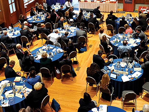 An overhead view of Alumni Council in a meeting.