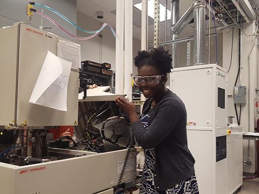 Ama Agyapong, a graduate student in the Department of Materials Science and Engineering, works in the lab. 