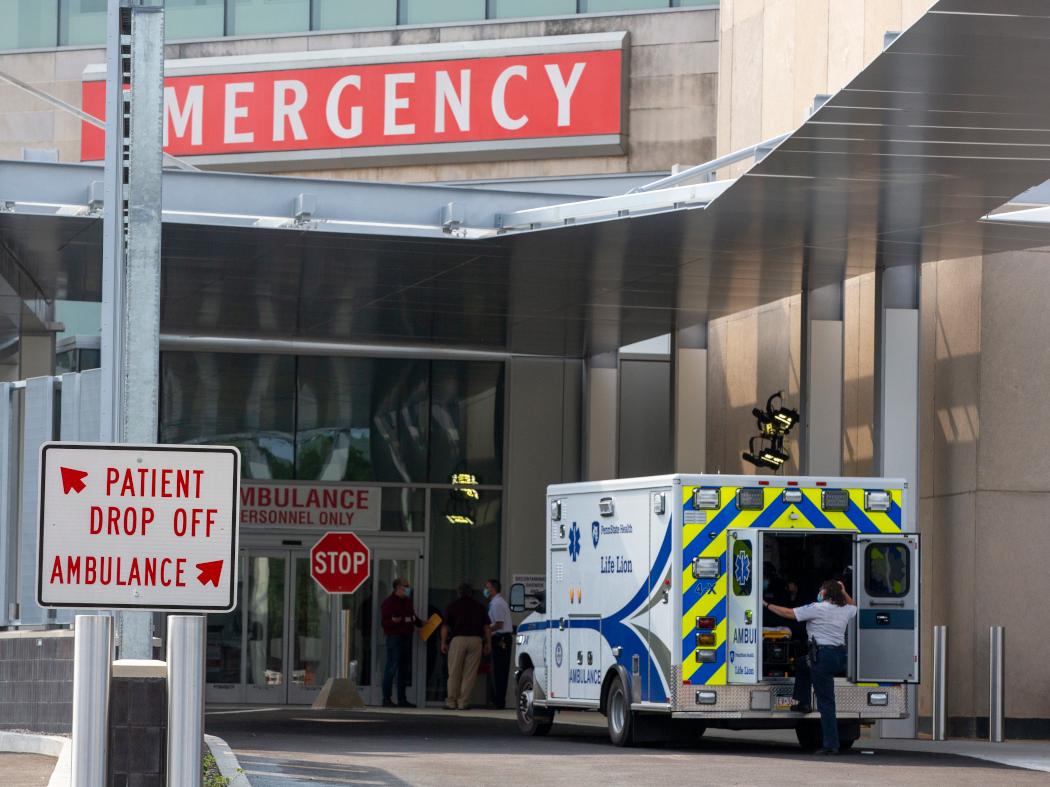 An ambulance parked outside of an emergency room