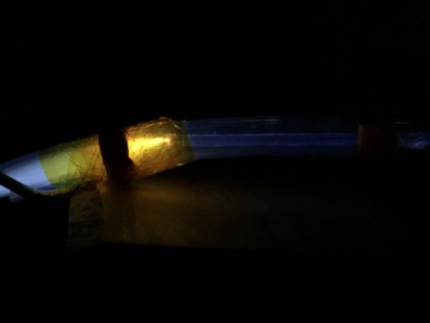 Image of a plasma plume generated from flowing argon in a plastic tube.