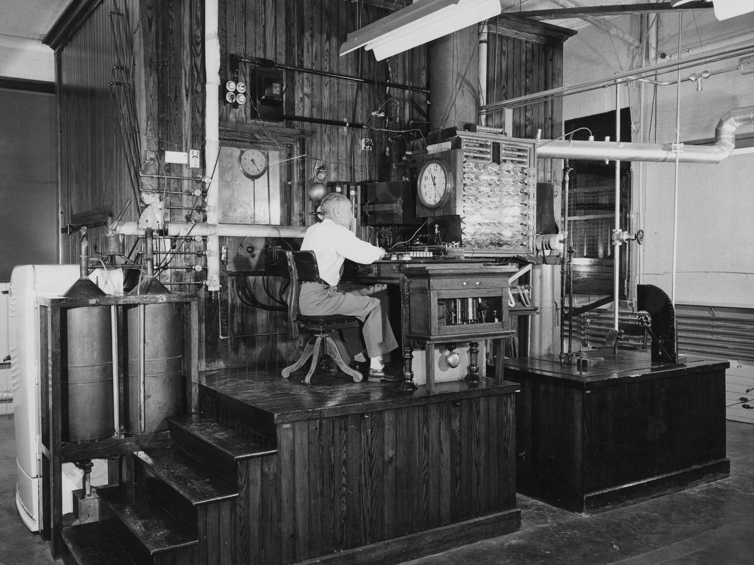 A man seated at the Armsby Respiration Calorimeter