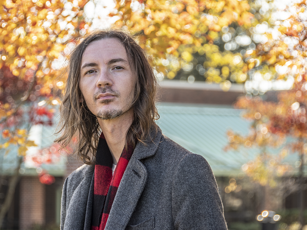 A picture of Art Zilleruello with a background of autumn leaves