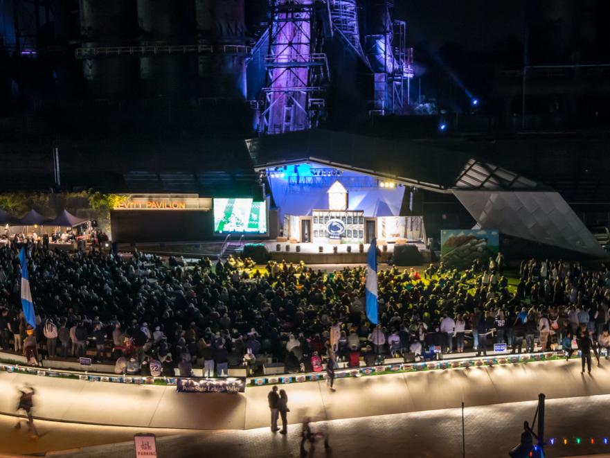Levitt Pavilion at ArtsQuest full of people watching a game on big screen