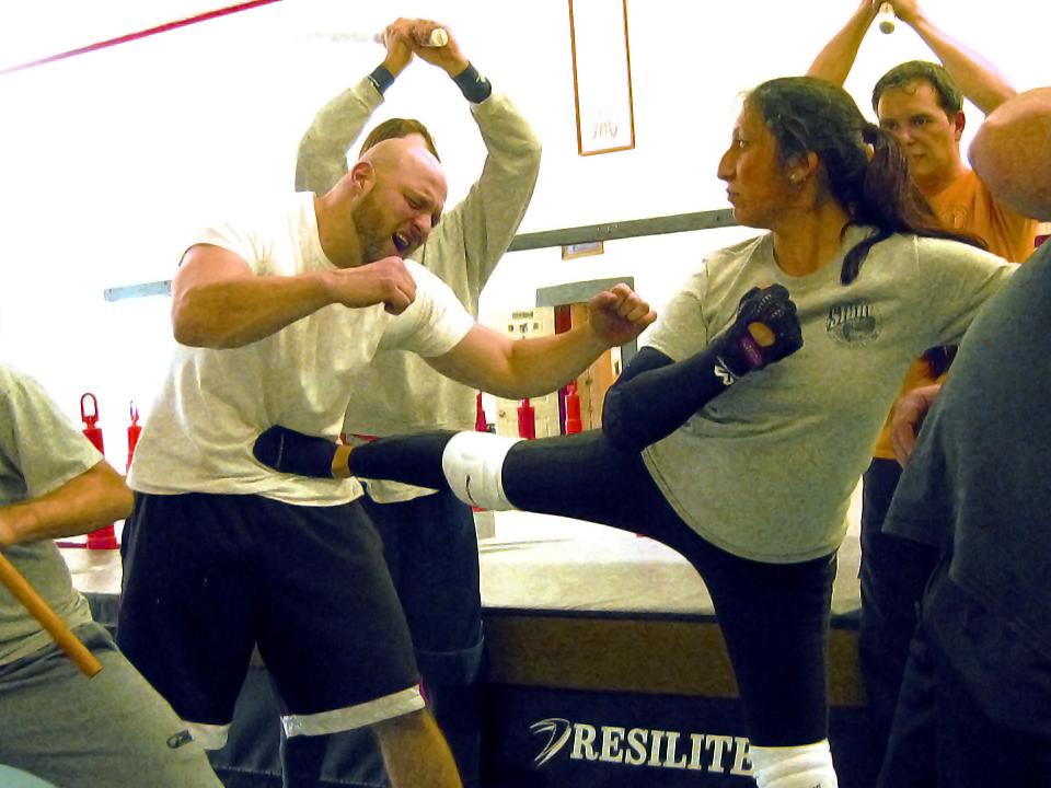 A posed picture of student Ashley Balas with other stunt people at Stunt Predators