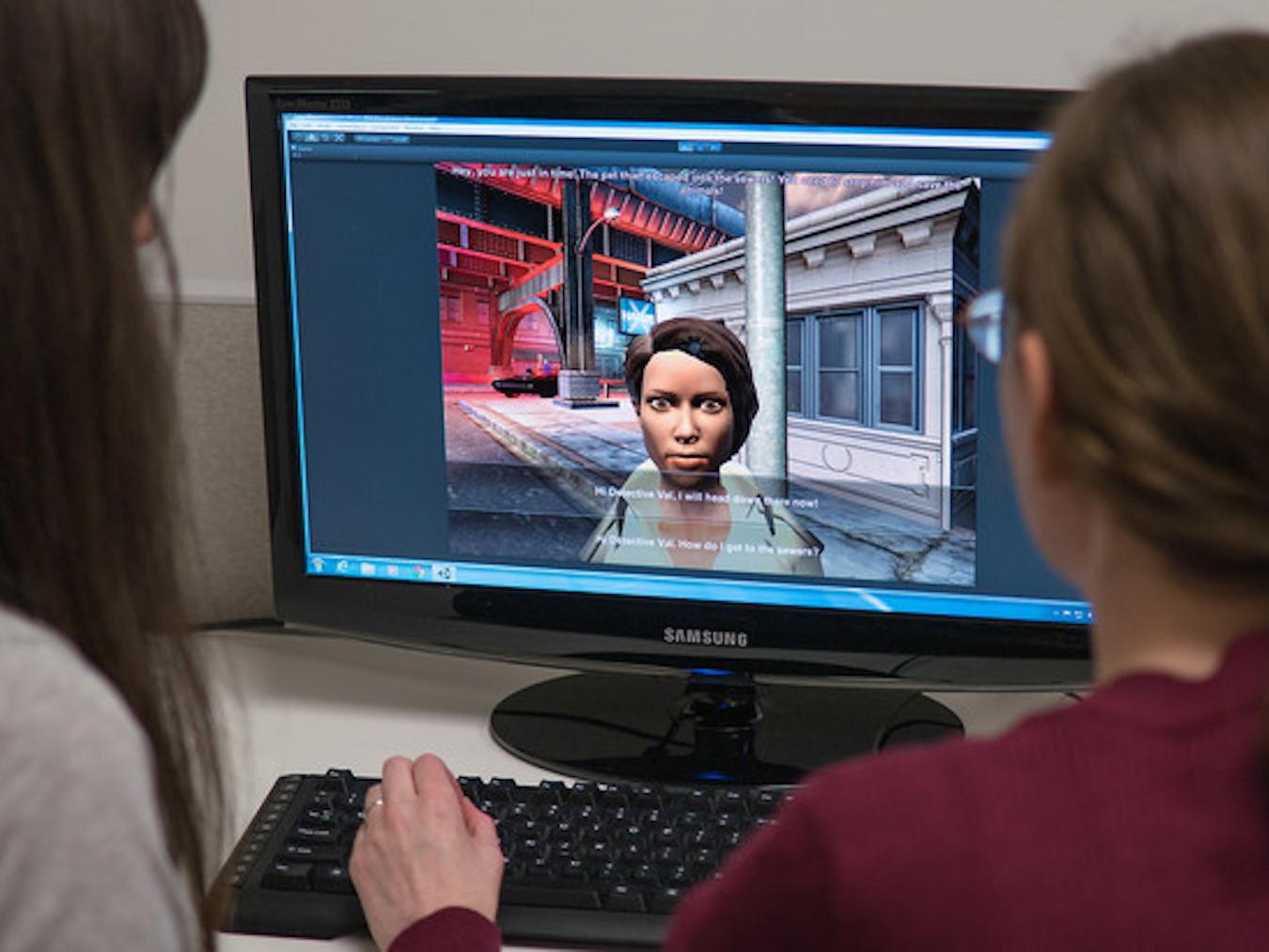Students playing autism computer game.