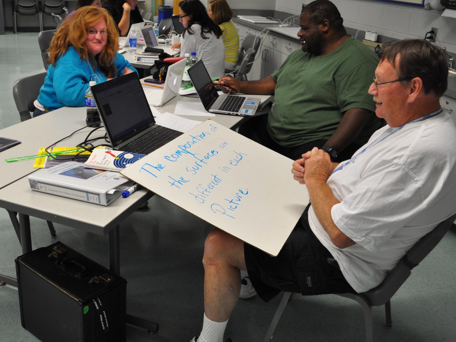 Teachers participate at a workshop