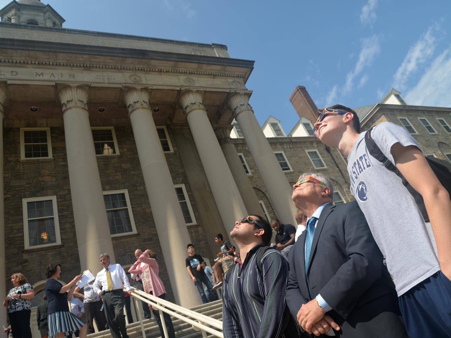 Barron and two students in front of Old Main