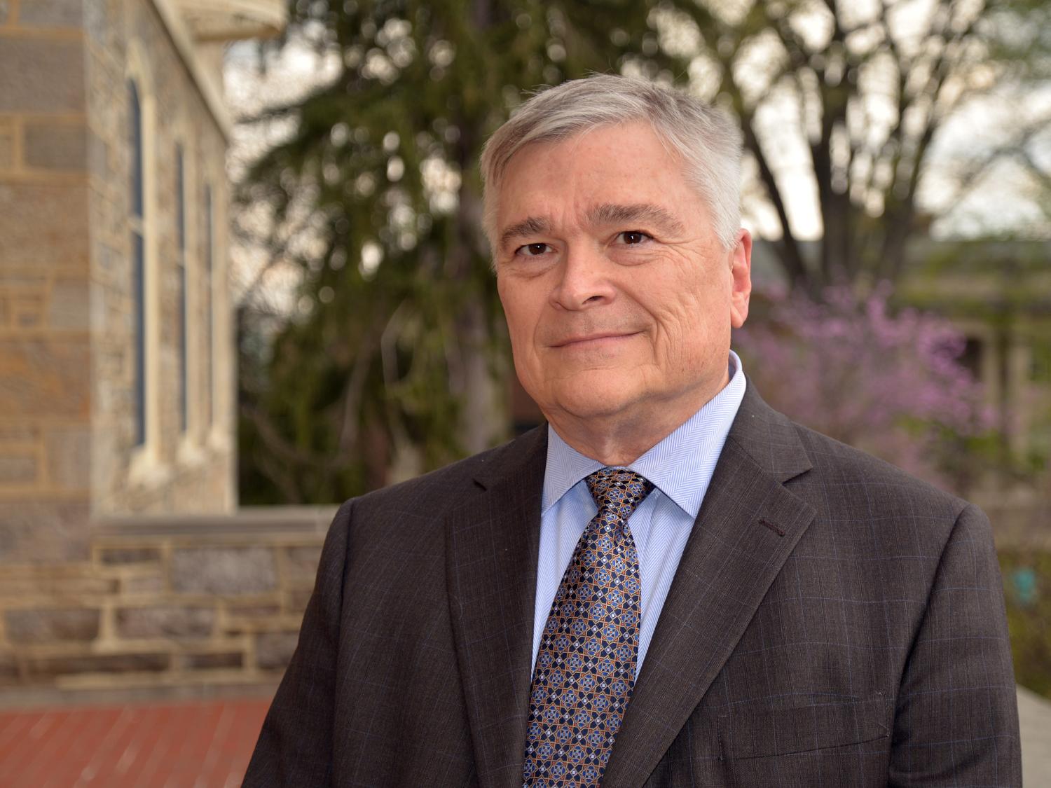 Portrait of Penn State President Eric Barron in front of Old Main on April 22, 2016.