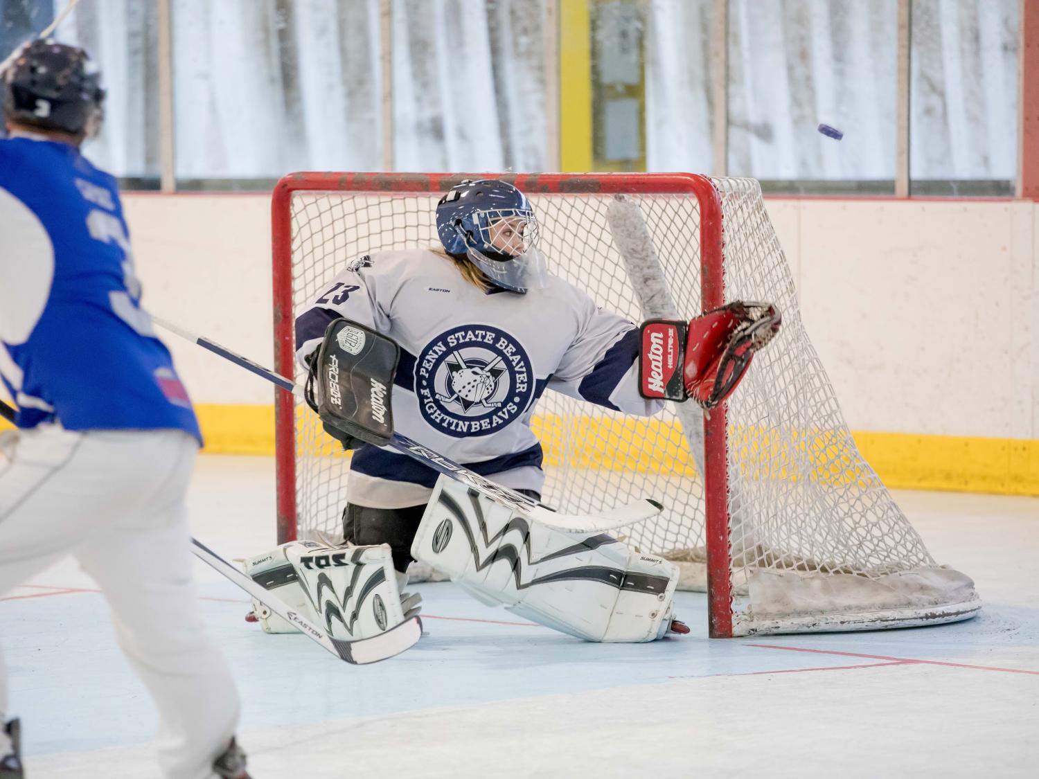 Goalie Katie work watches as the puck careens off her glove.