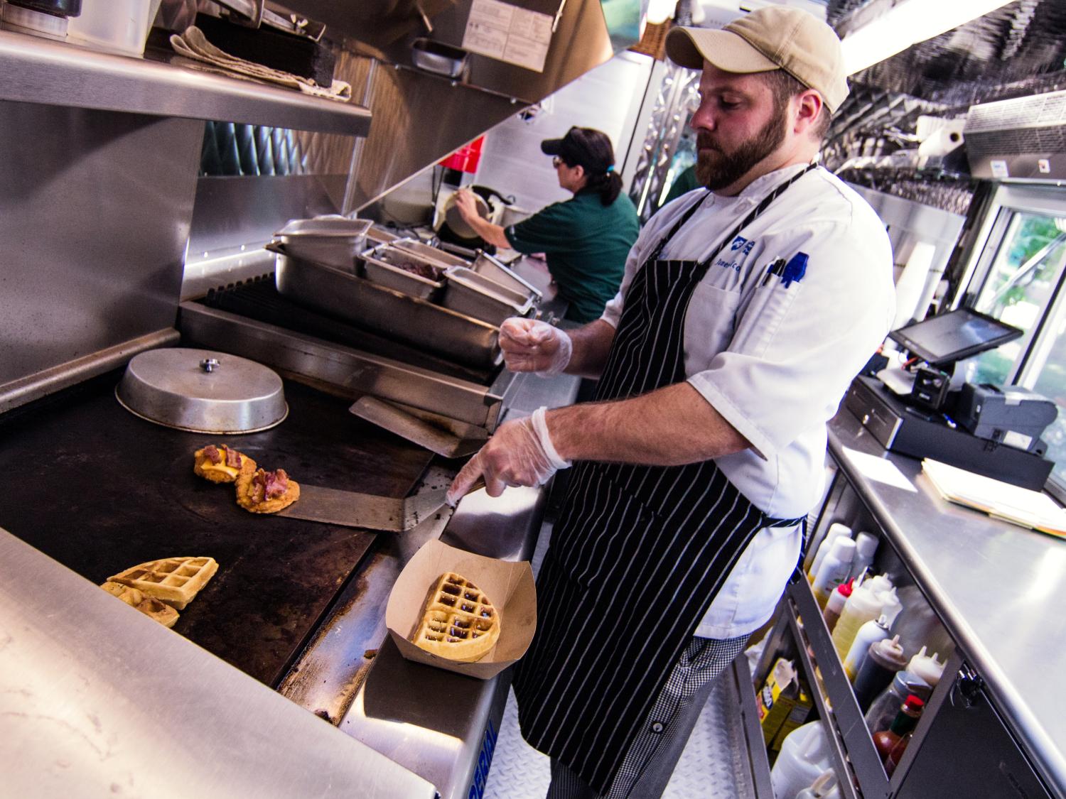 Chef James Nicosia works inside the Behrend Clipper food truck