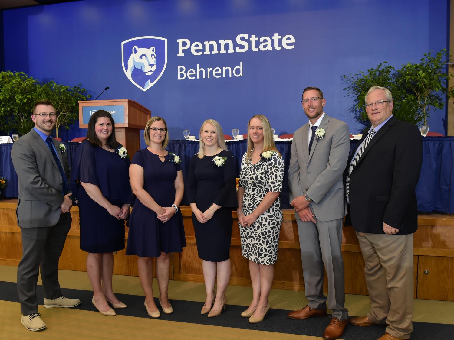 Six alumni members pose with Penn State Behrend Director of Athletics Brian Streeter.