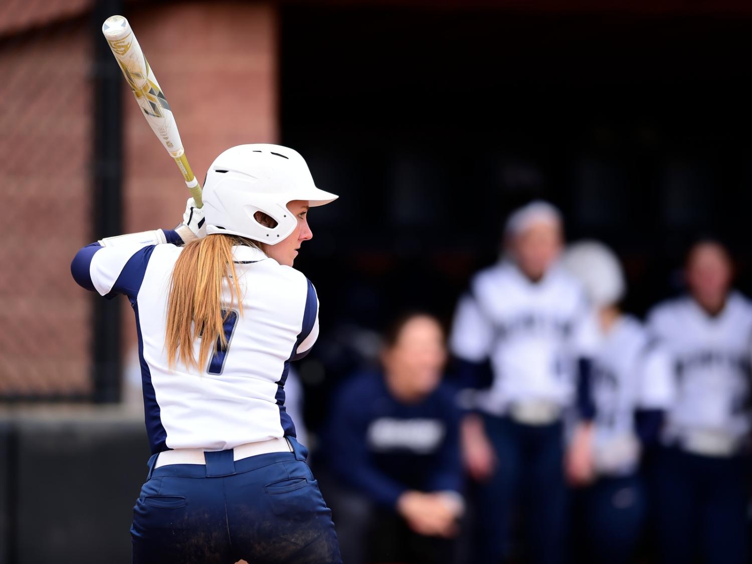 A Penn State Behrend softball player prepares to hit the ball.