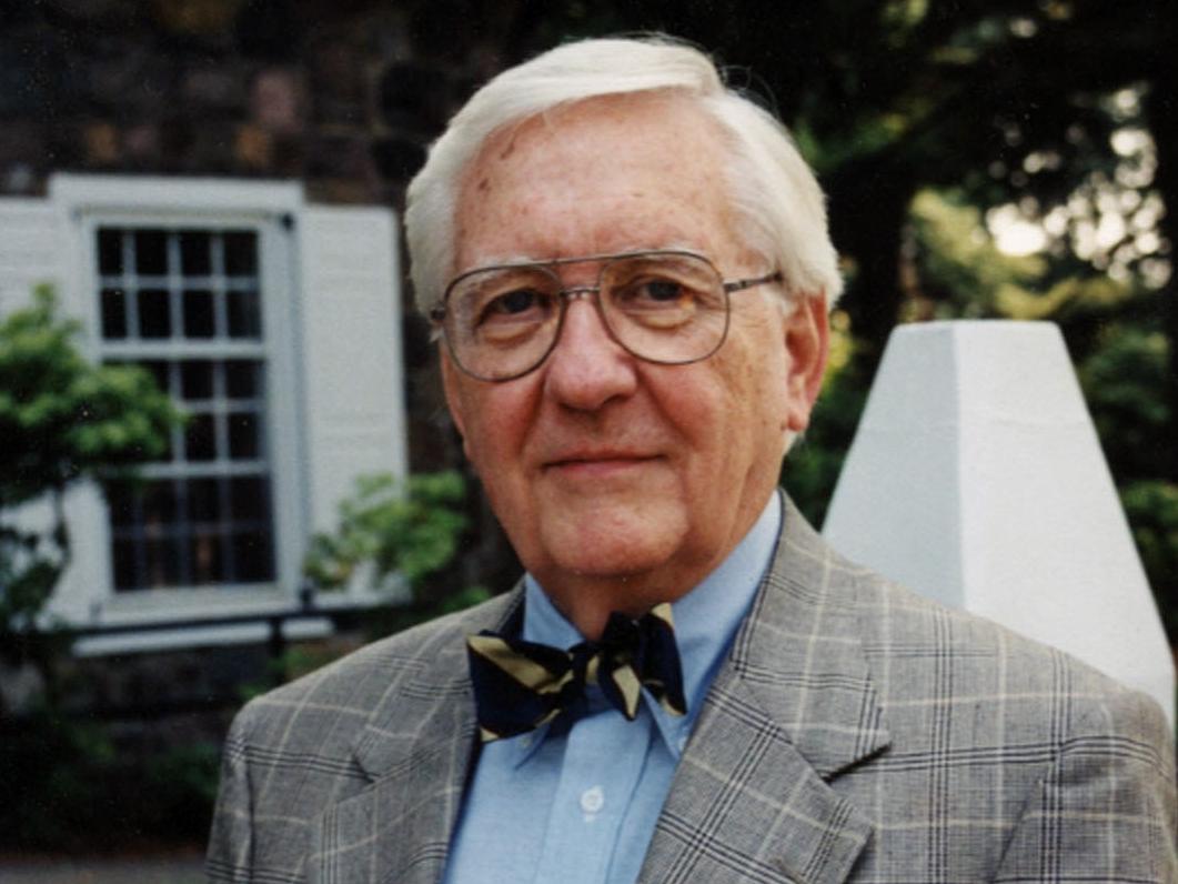 Former Penn State Behrend administrator Ben Lane stands in front of the college's Glenhill Farmhouse.