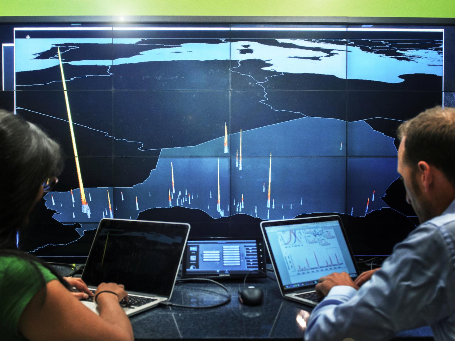 Nita Bharti and Matt Ferrari with satellite data