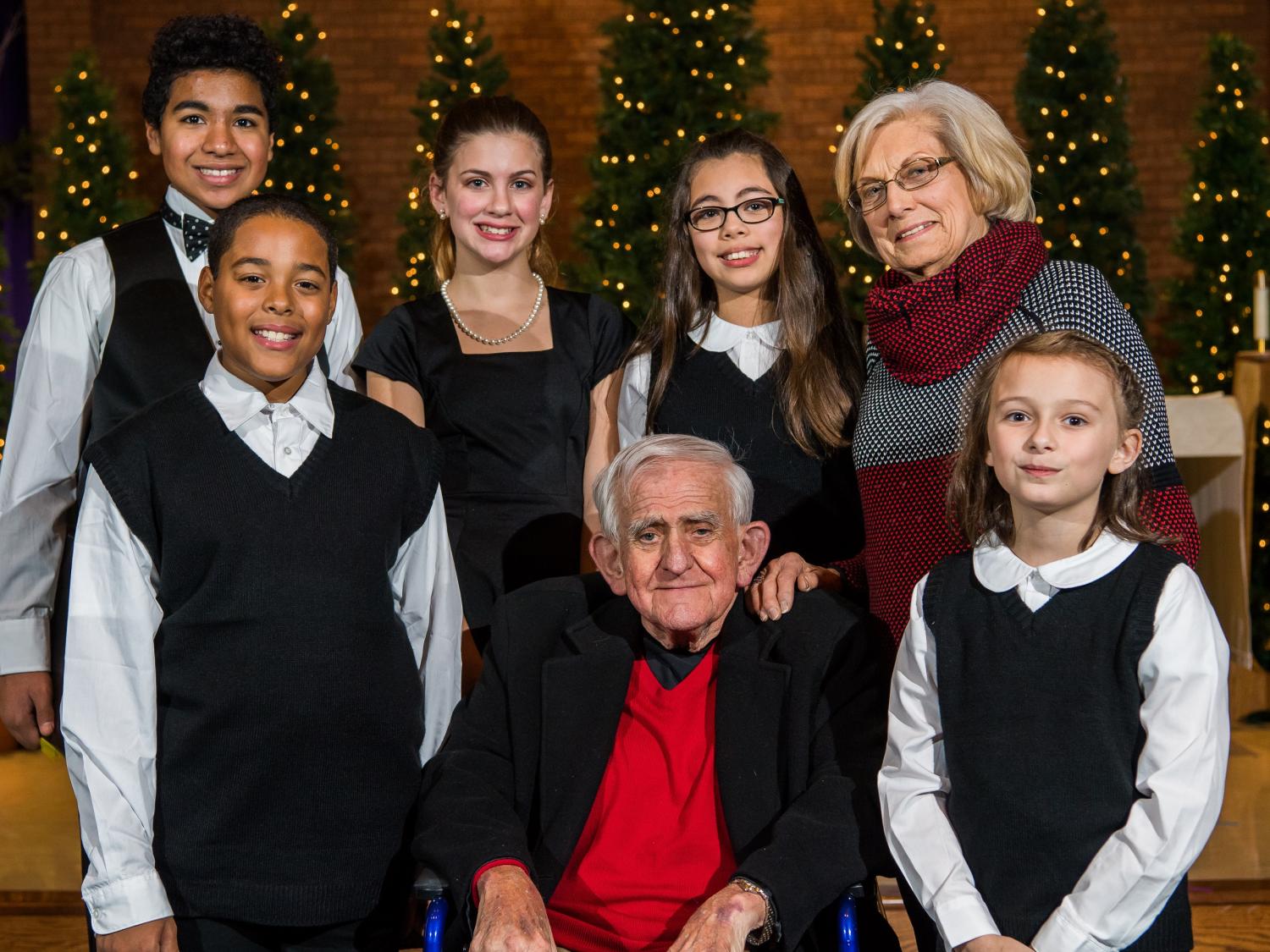 Bill and Martha Hilbert pose with members of the Young People's Chorus of Erie