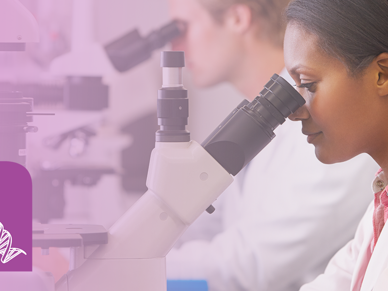 Image of woman looking into microscope