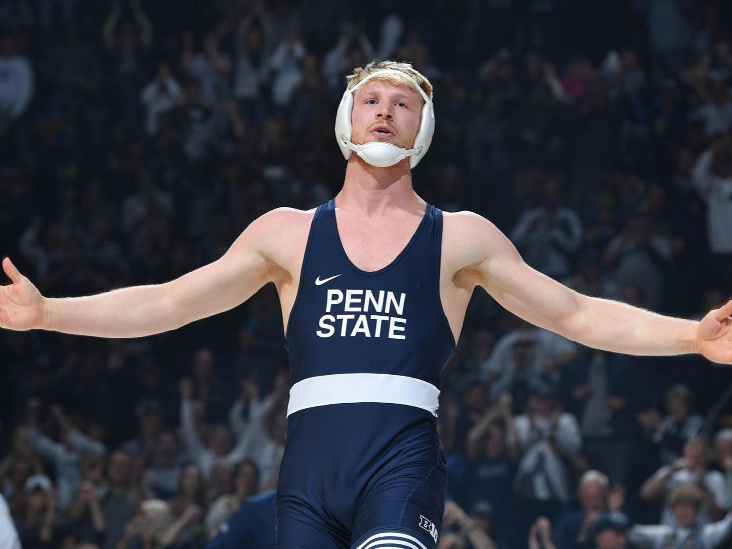 Penn State wrestler Bo Nickal with arms outstretched. 