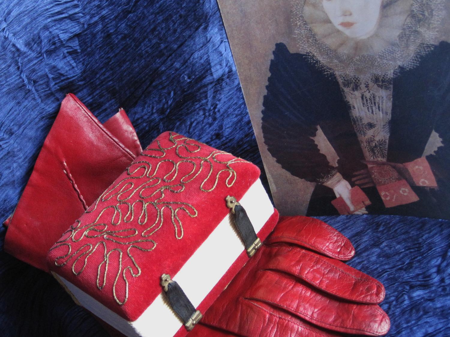 Handmade book from red leather glove.