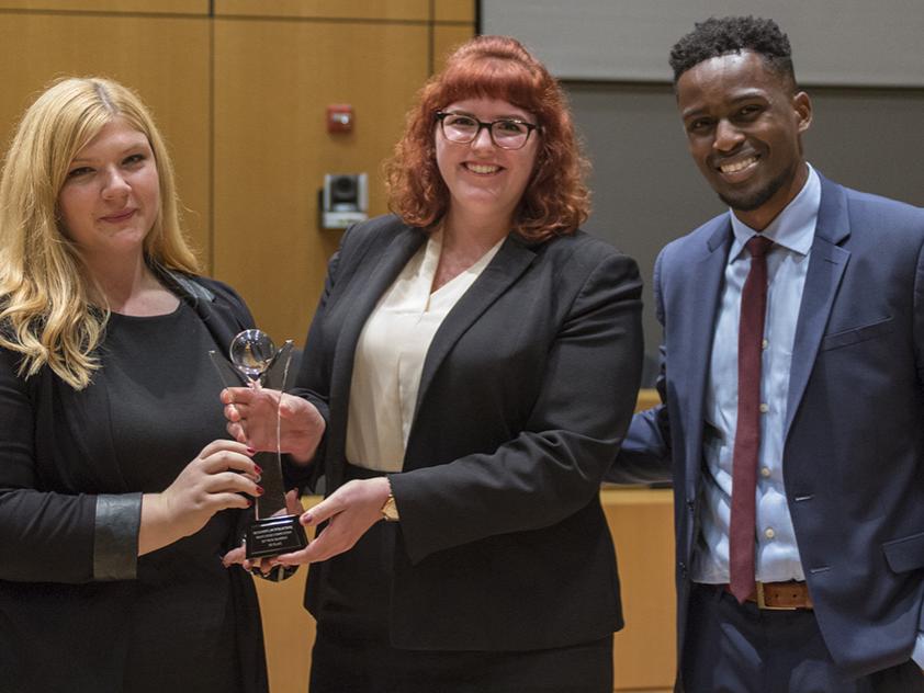 Jordan Yatsko (left) and Hanna Borsilli (right) receive the Christian R. Burne Award from Tristan Chase O’Savio.