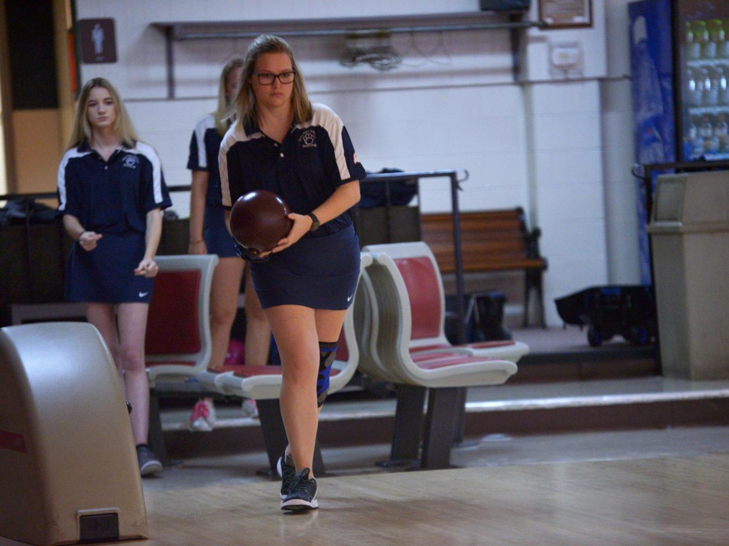 A Penn State Behrend bowler prepares to roll the ball.