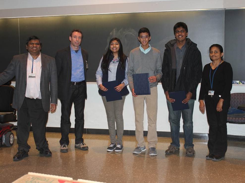 The 2015 Brain Bee winners pose with faculty members.