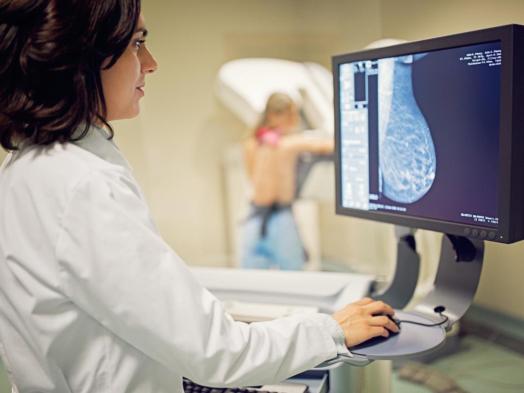 Doctor is working with mammography x-ray scanner in hospital
