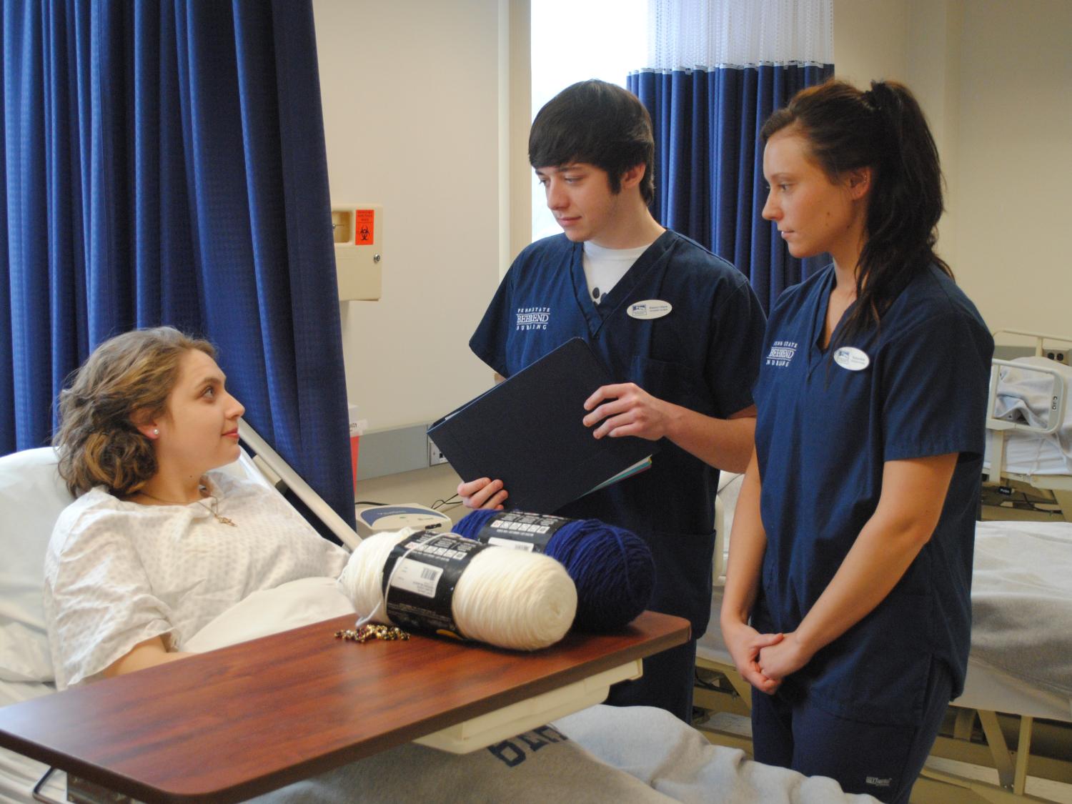 Brenna Lanager played the role of an elderly patient this past fall in a NURS 112 class. Students Hunter Olsen and Nerissa Rich were tasked with preparing Lanager for surgery as part of the simulation.