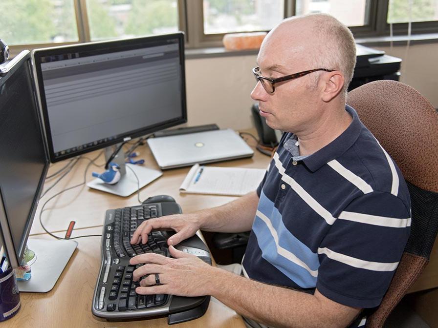 World Campus professor at computer