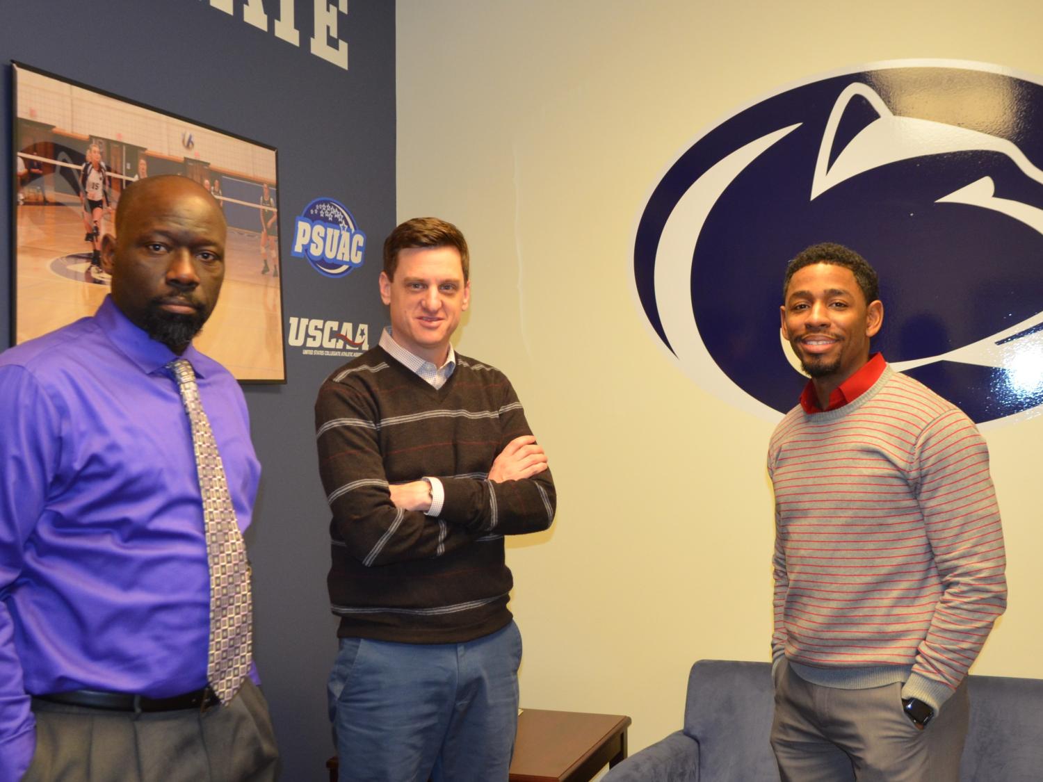 Three men standing in a Shenango campus office following a meeting about athletics.