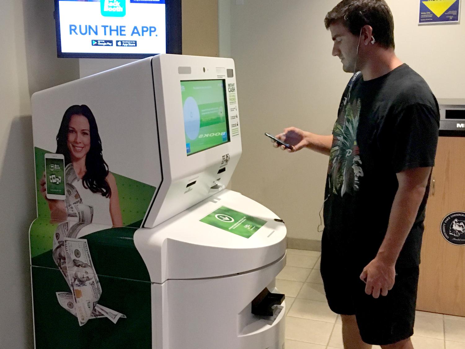 Student using BuyBack Booth