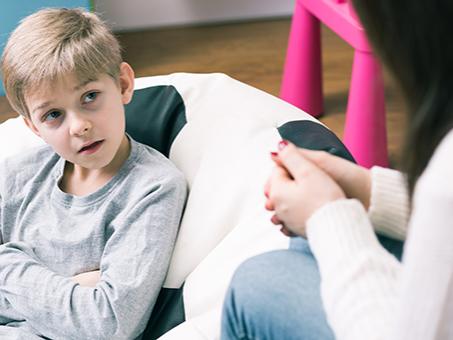 A boy talks to his mom
