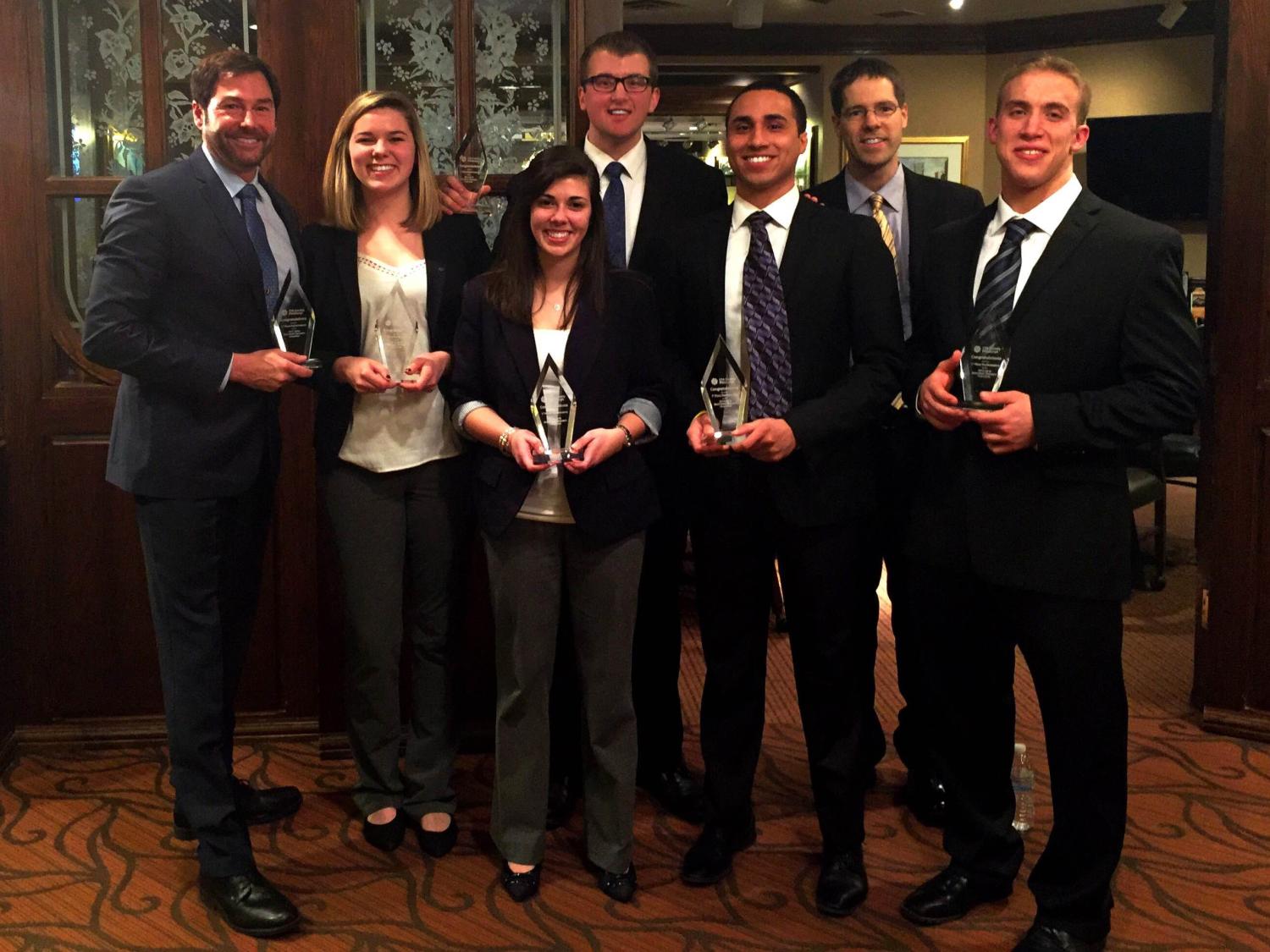 Members of Penn State Behrend's CFA research team pose with trophies