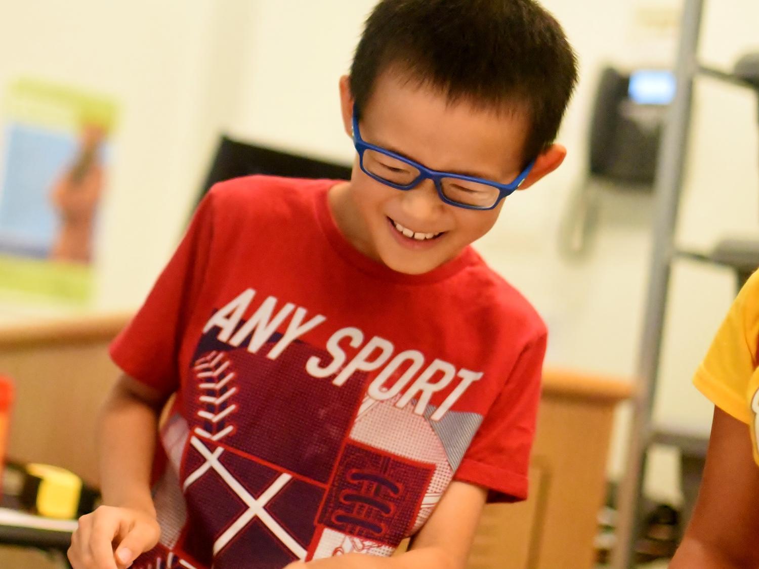 A student works in a robotics lab at Penn State Behrend's College for Kids.
