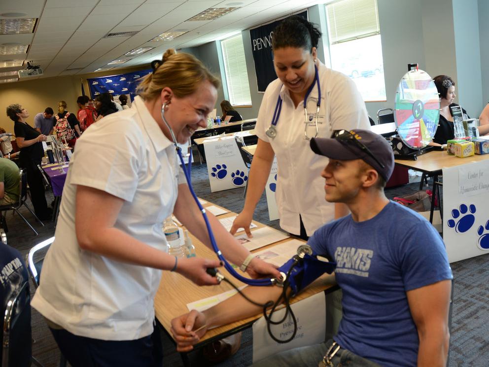 a person getting blood pressure taken
