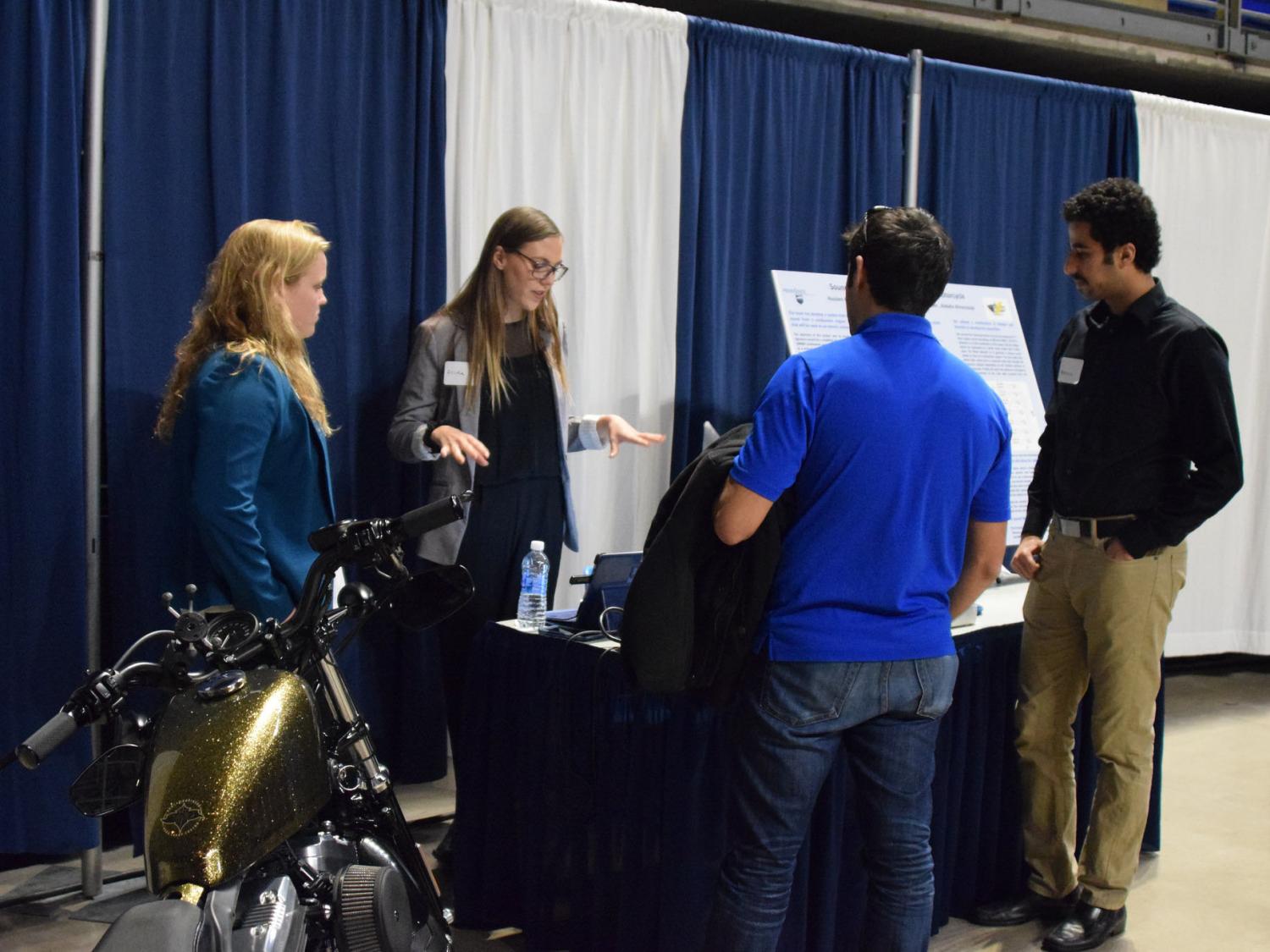 Students describe their project at the Design Showcase