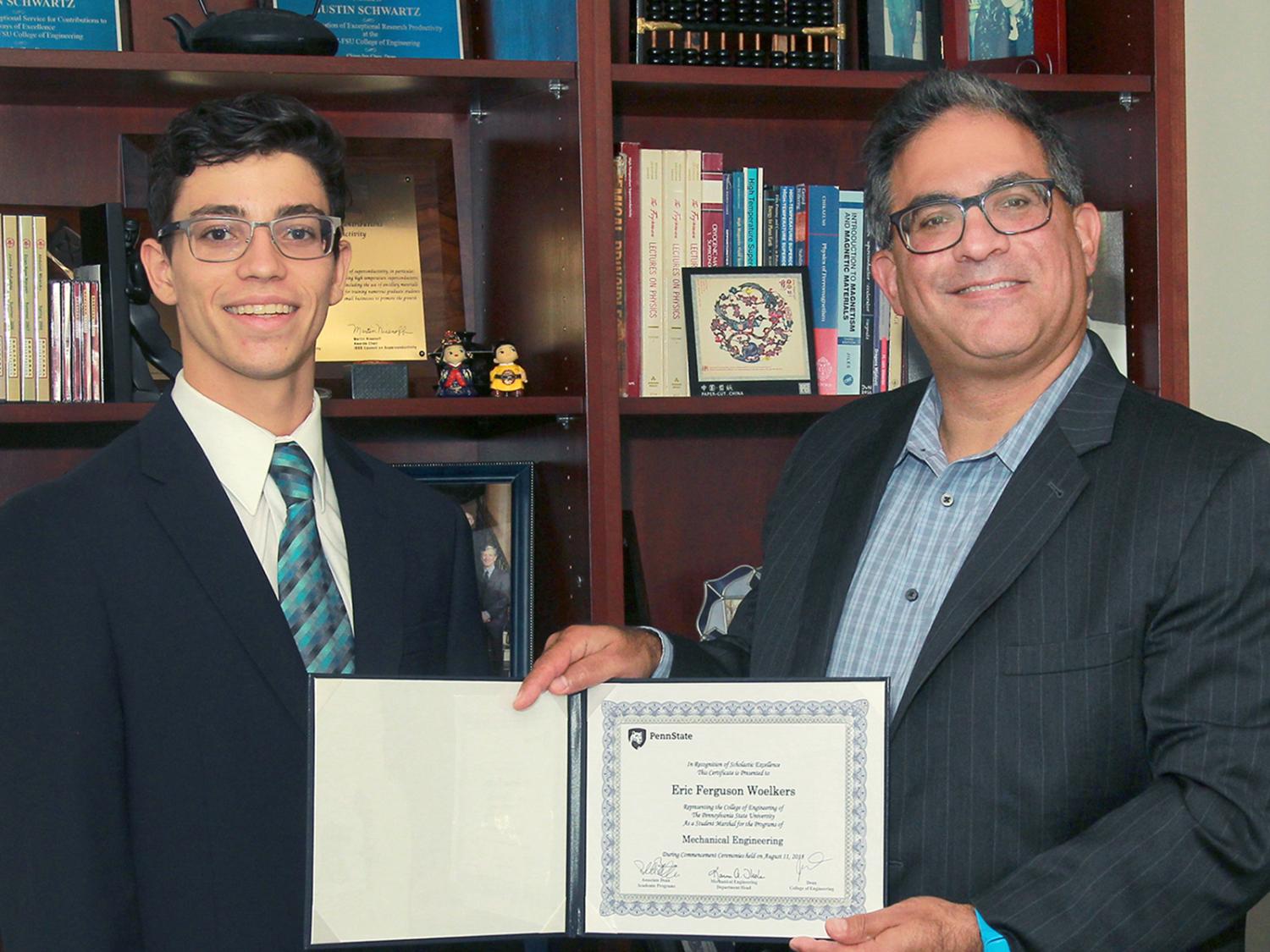 Student marshal Eric Woelkers, left, with Justin Schwartz, the Harold and Inge Marcus Dean of Engineering at Penn State.
