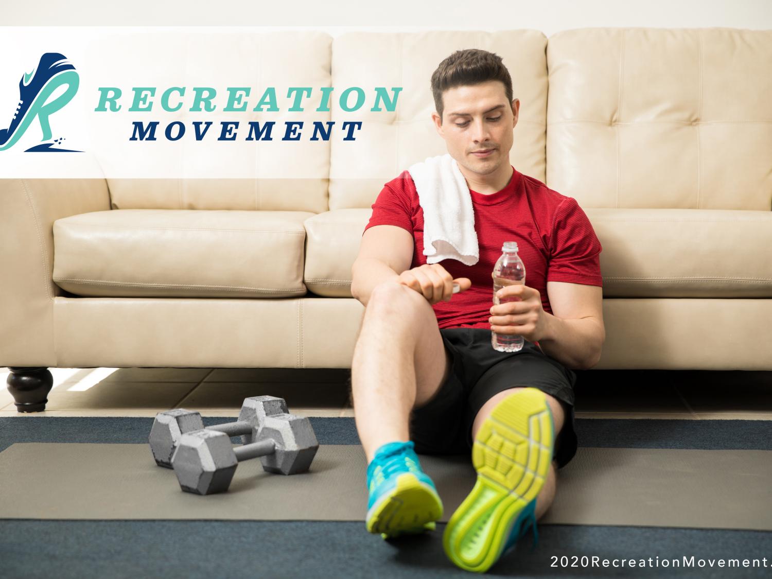 Man sitting in front of couch after workout