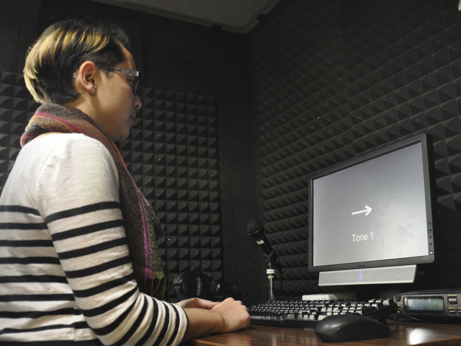 student in soundproof booth