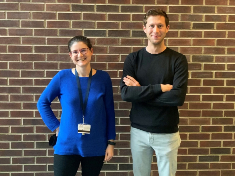 Chromatir Co-founders Lauren Zarzar and Caleb Meredith stand next to each other against brick wall