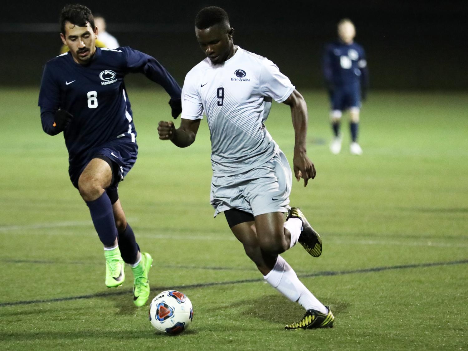 Mohamed Camara dribbles past a defender