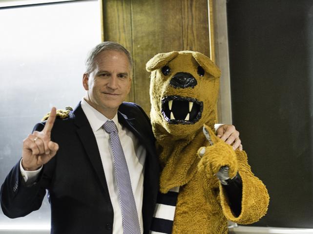 robert cardillo standing next to the penn state nittany lion