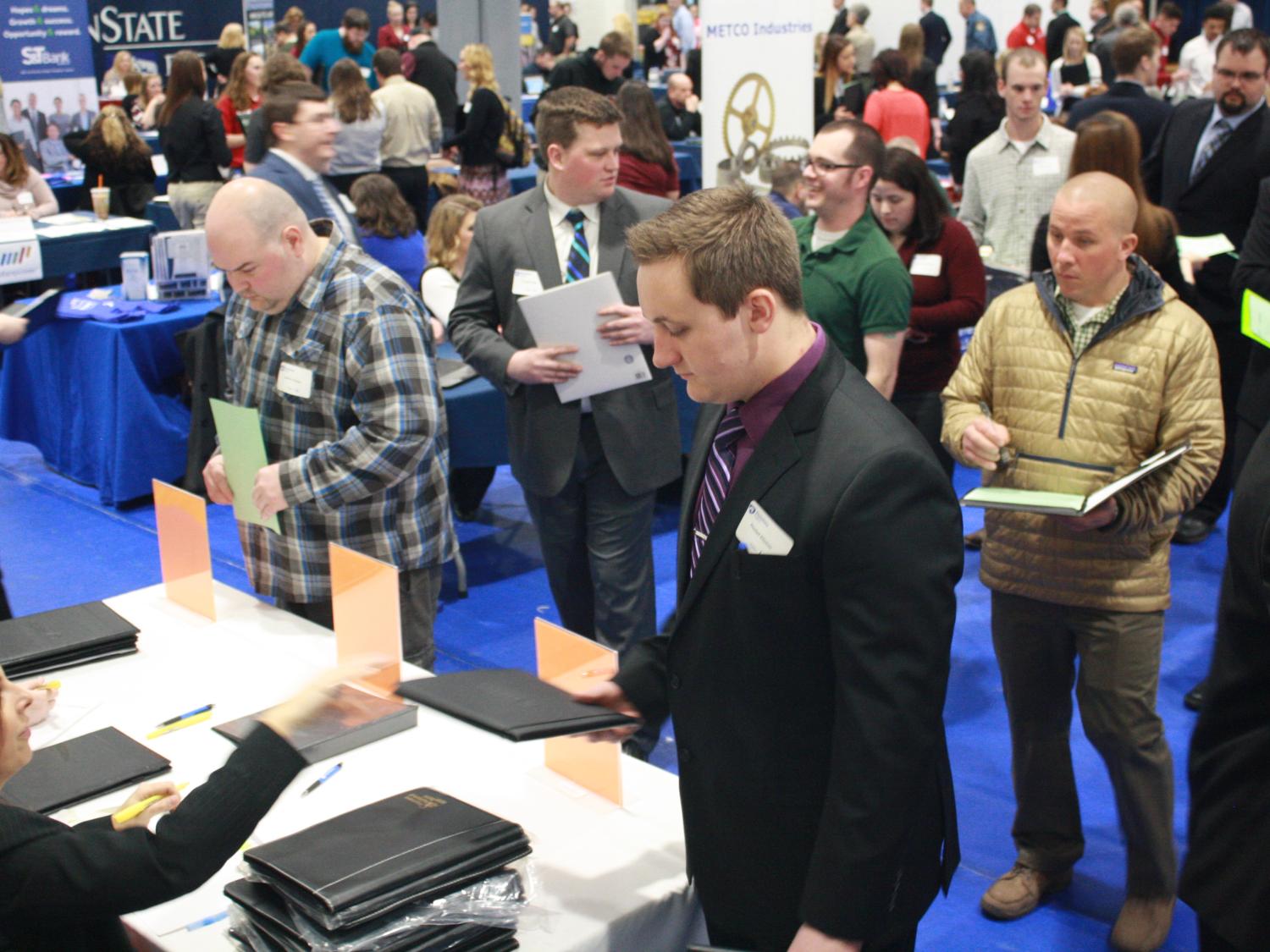 Student Dan Hinton prepares to meet with potential employers at the Penn State DuBois Career Fair. 