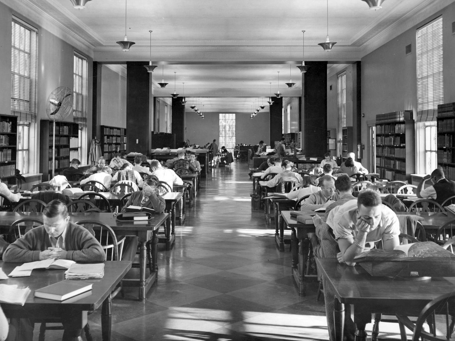 Penn State students studying on 2nd floor of Pattee Library in 1950s