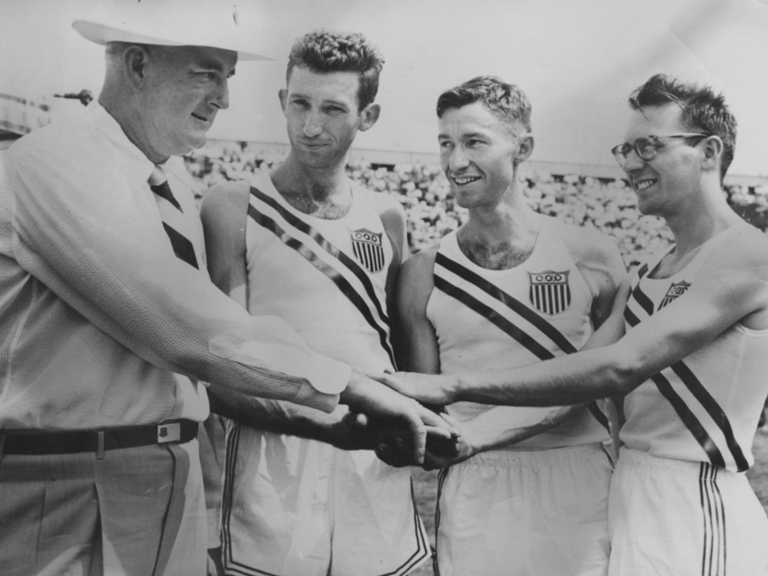 Coach Chick Werner, Horace Ashenfelter, William Ashenfelter, and Curt Stone are ready for the 1952 Helsinki Olympics. 
