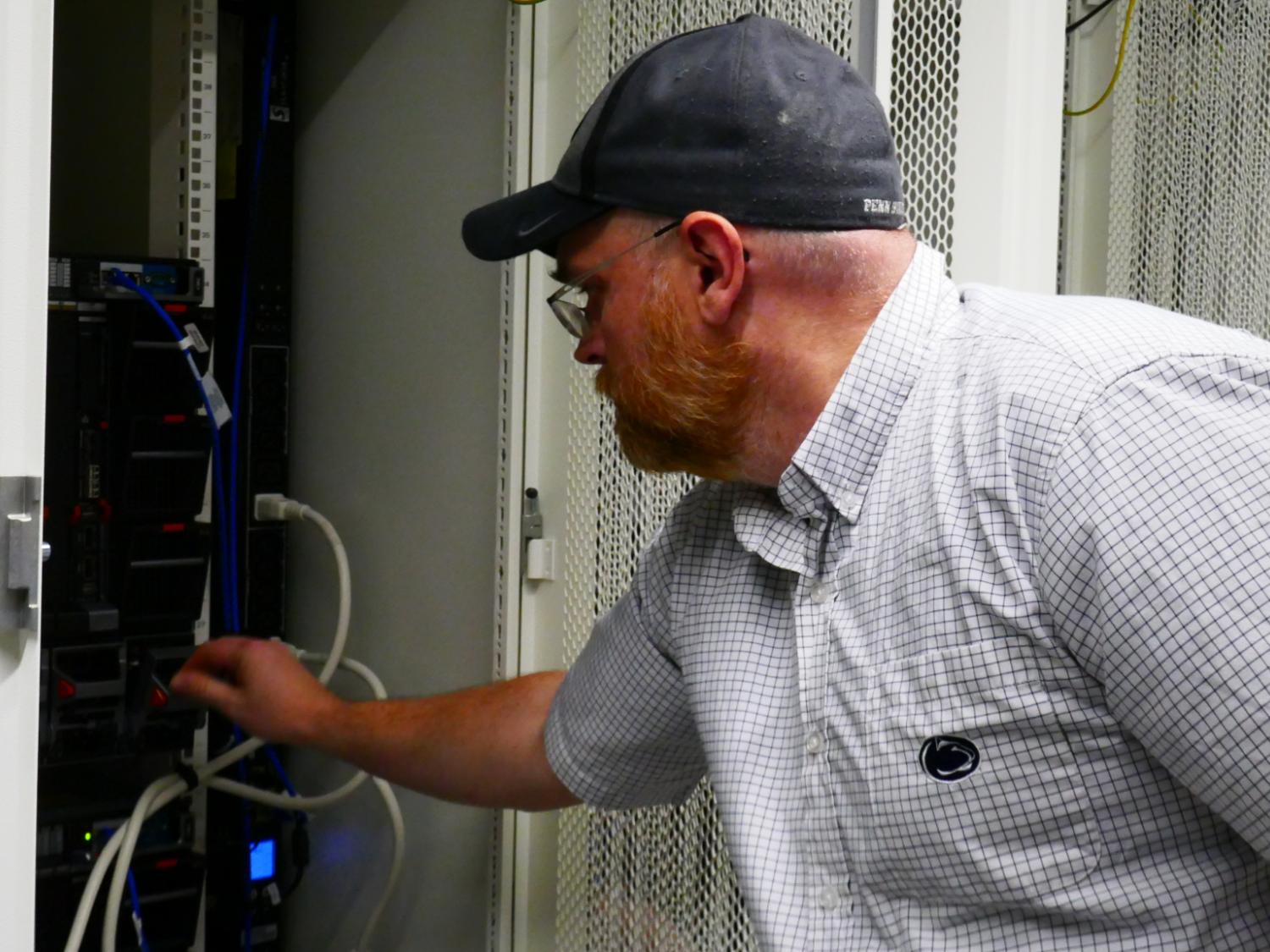 ICS system administrator checks computing hardware