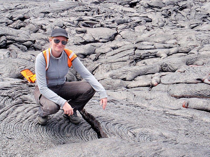 Penn State researcher Christelle Wauthier stands on a cooled lava flow