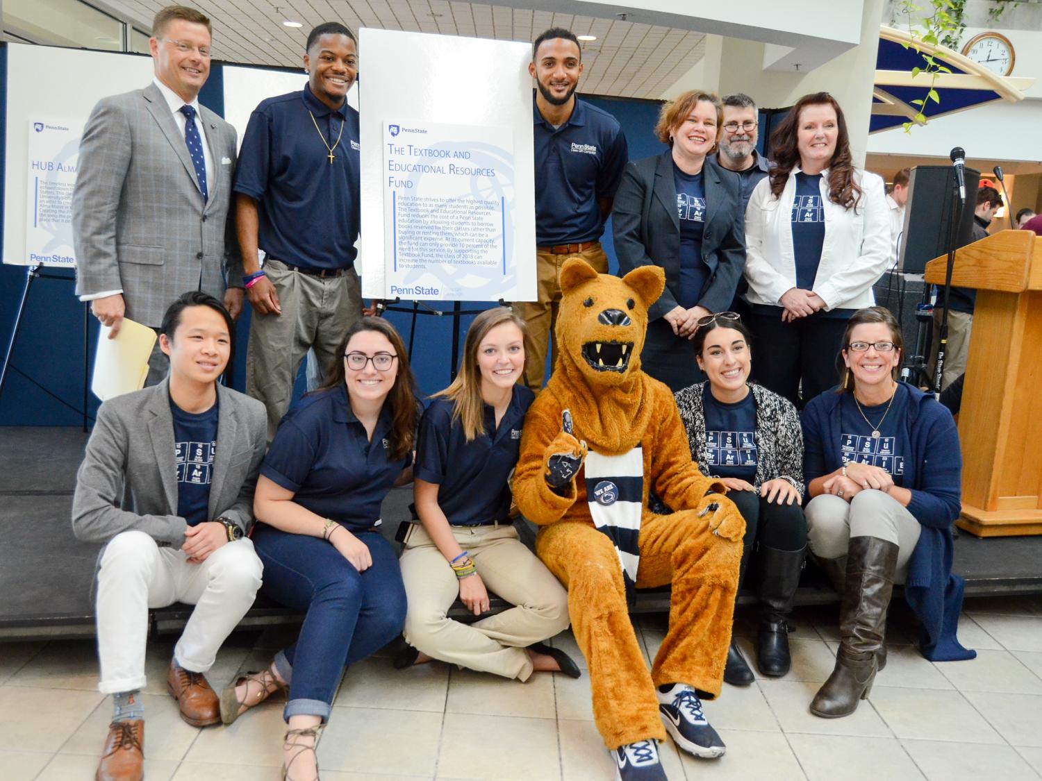 Photo of University Libraries' Development staff pose with the Nittany Lion and members of the Class of 2018 at HUB Robeson