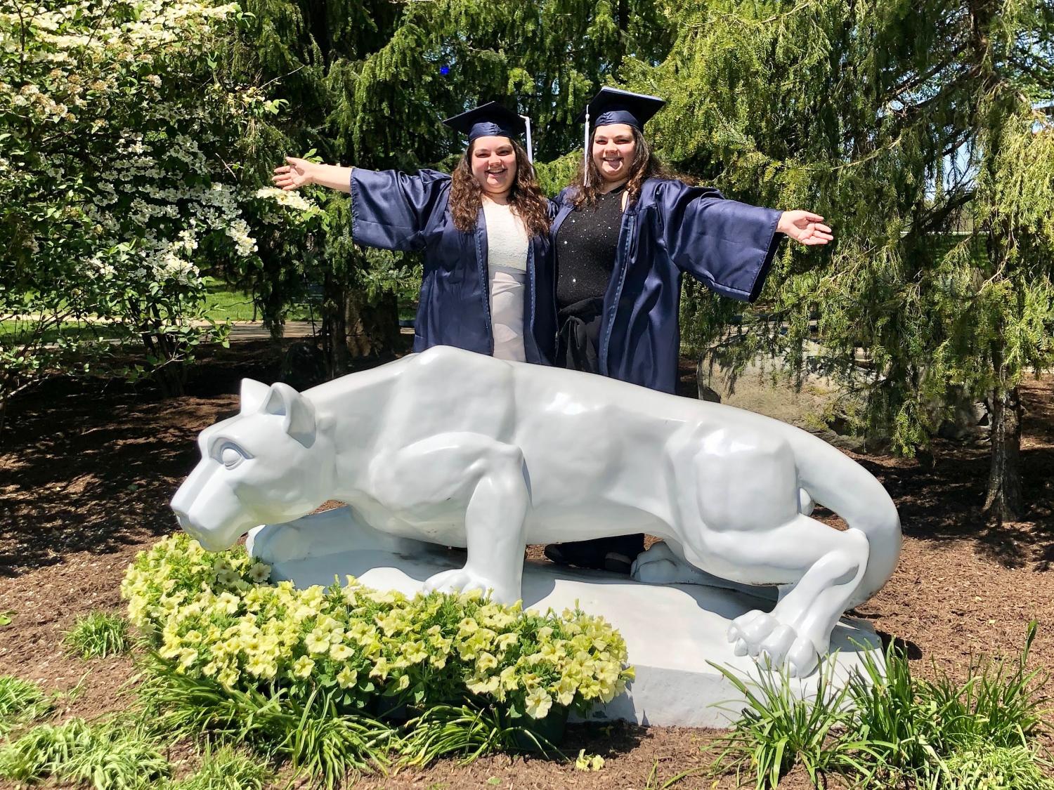 Twin sisters Chloe and Claudia Przybylski at the Penn State Brandywine Lion Shrine.