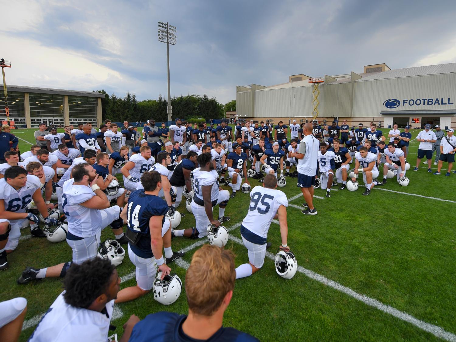 Franklin addressing team at outdoor practice facility